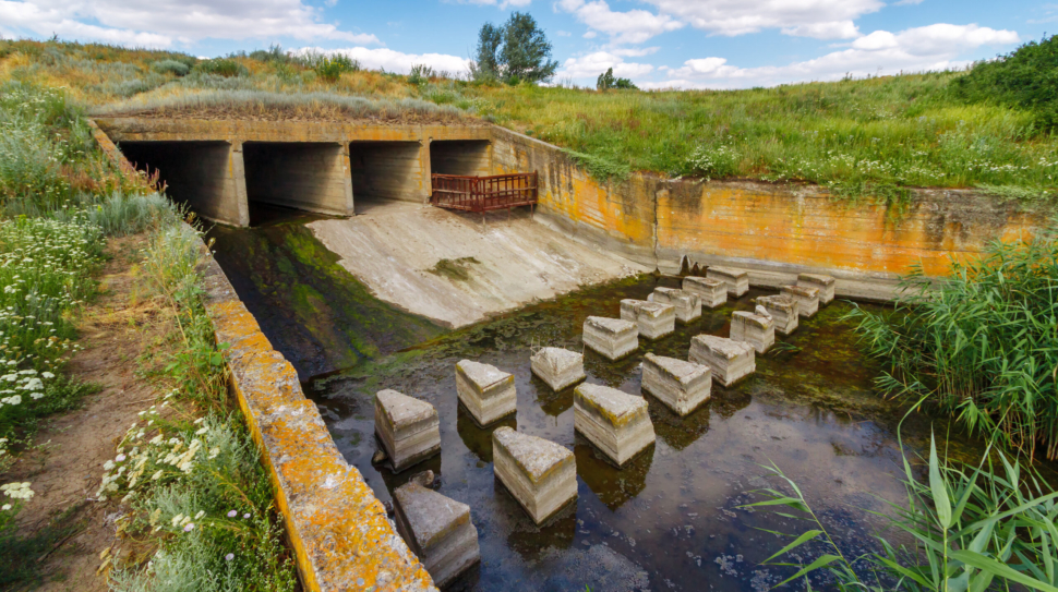 Concrete,Discharge,Sluice,In,Earthen,Dam,On,Small,River,In