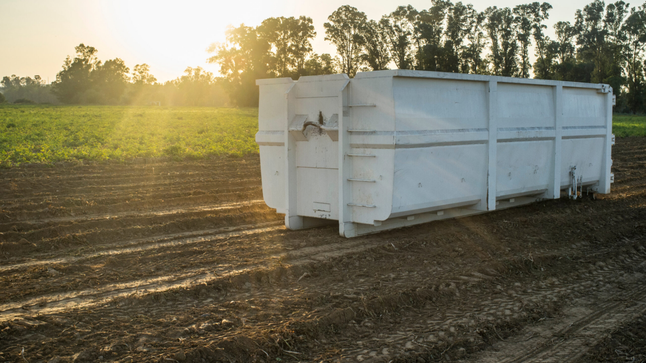 Container,For,Roll-off,Skip,Loader,At,Potatoes,Field,At,Sunset.