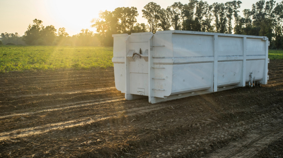 Container,For,Roll-off,Skip,Loader,At,Potatoes,Field,At,Sunset.